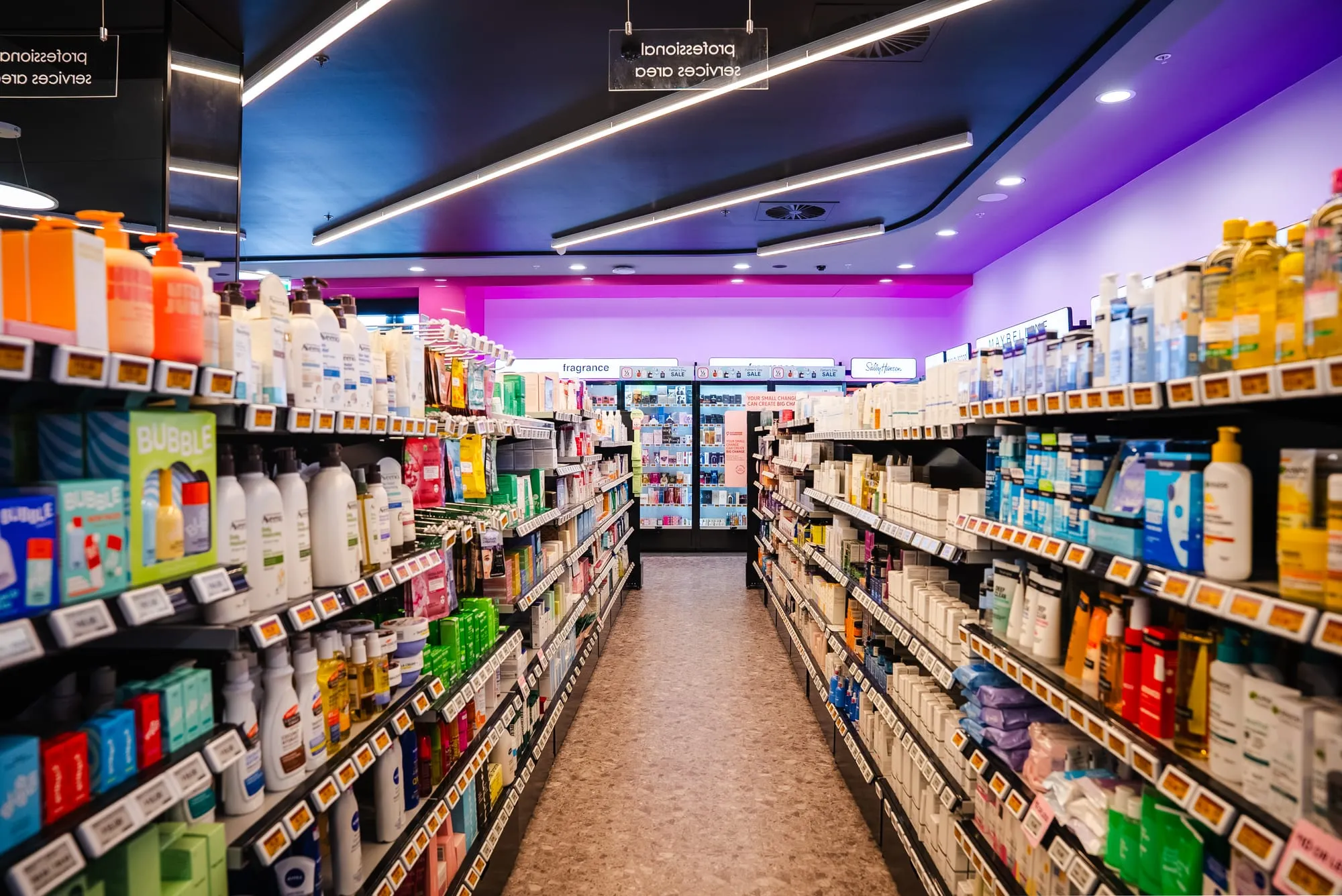 Beauty aisle beneath feature cove lighting