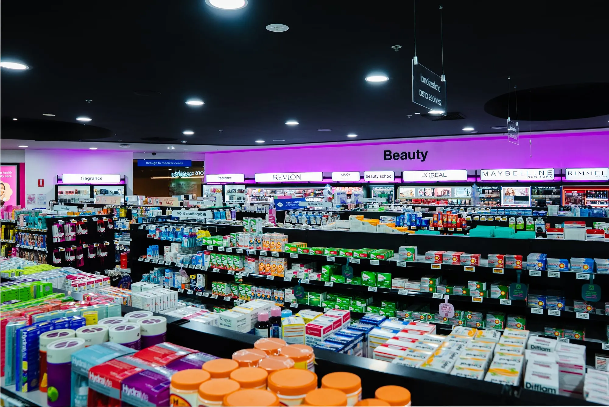 Beauty aisle with integrated shelving and lighting