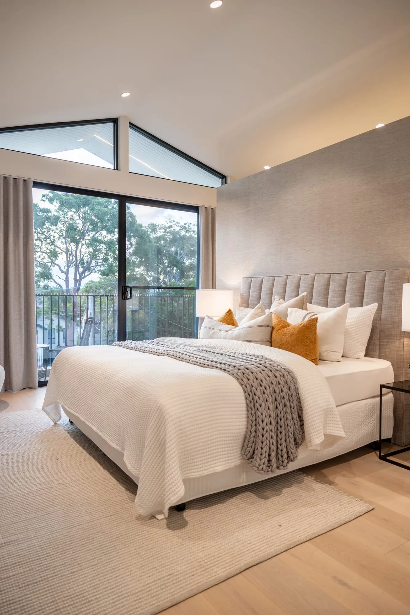 Bedroom opening to a private balcony