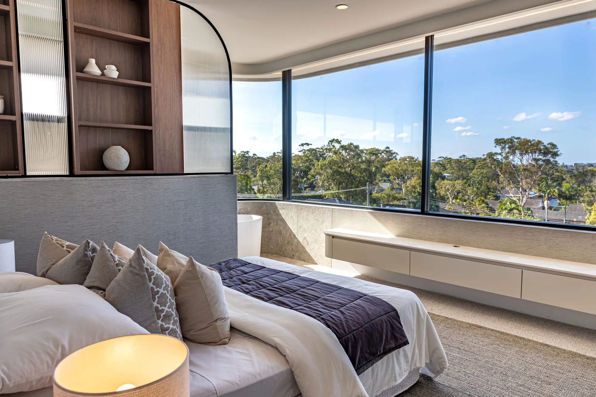 Main bedroom with treetop and water views