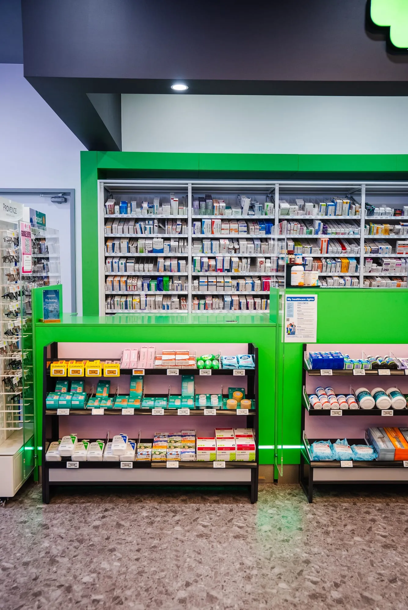 Prescriptions wall with backlit shelving