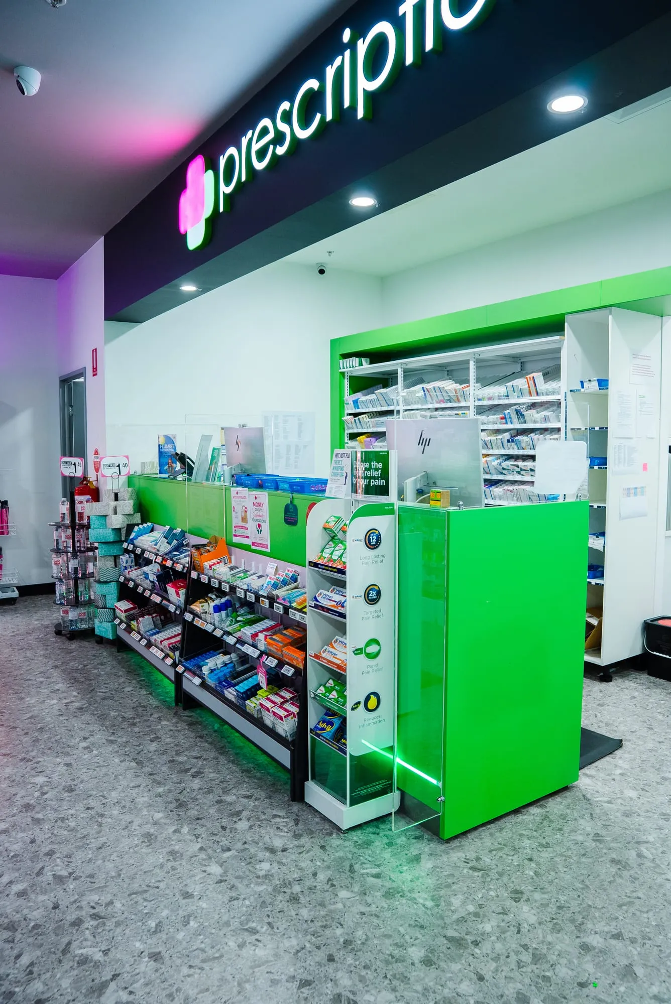 Pharmacy dispensary counter with backlit joinery