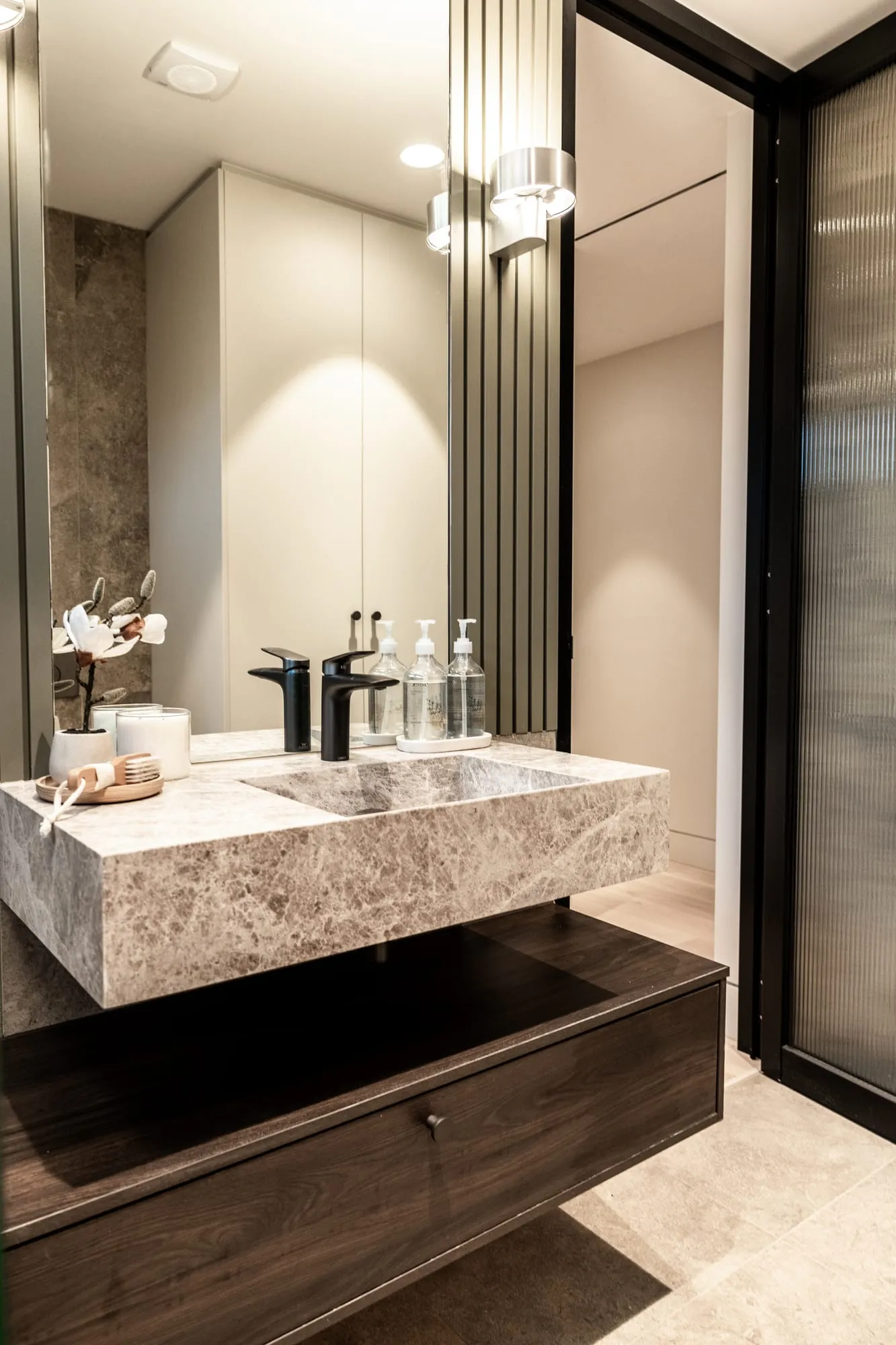 Floating stone vanity in the ensuite