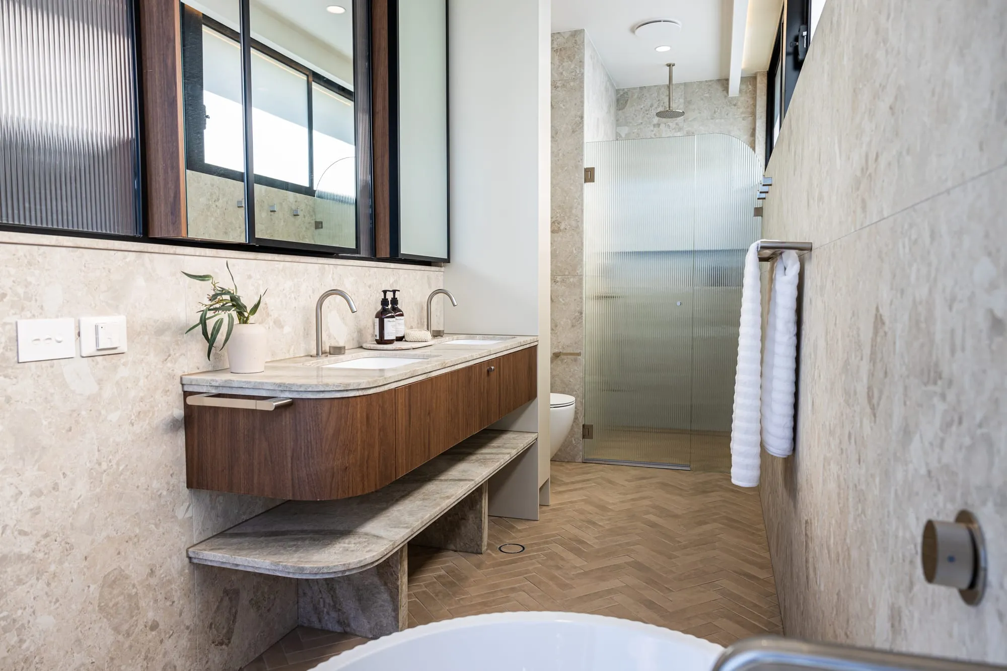 Double timber vanity with a natural stone benchtop