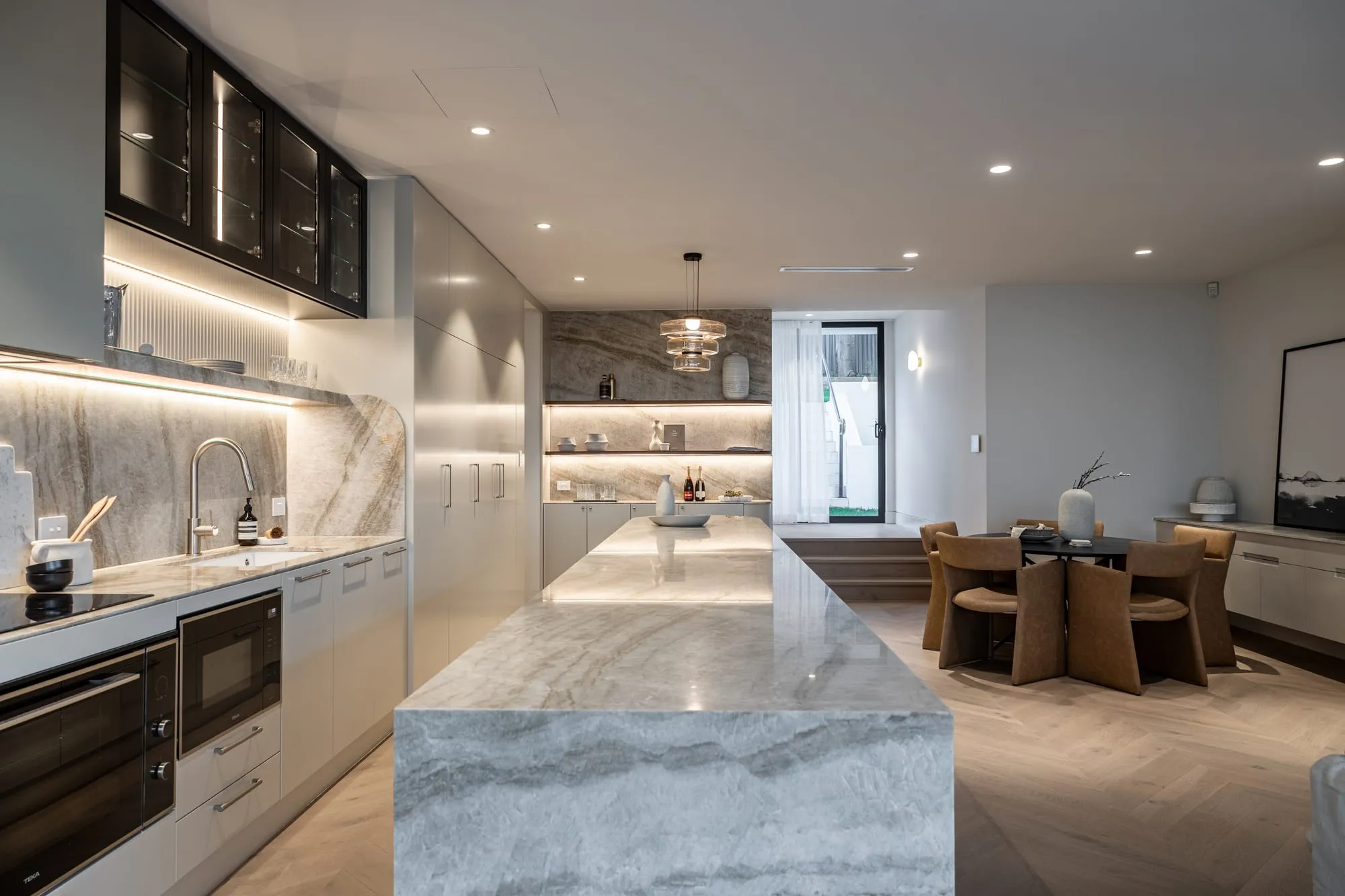Marble kitchen island opening to the dining area