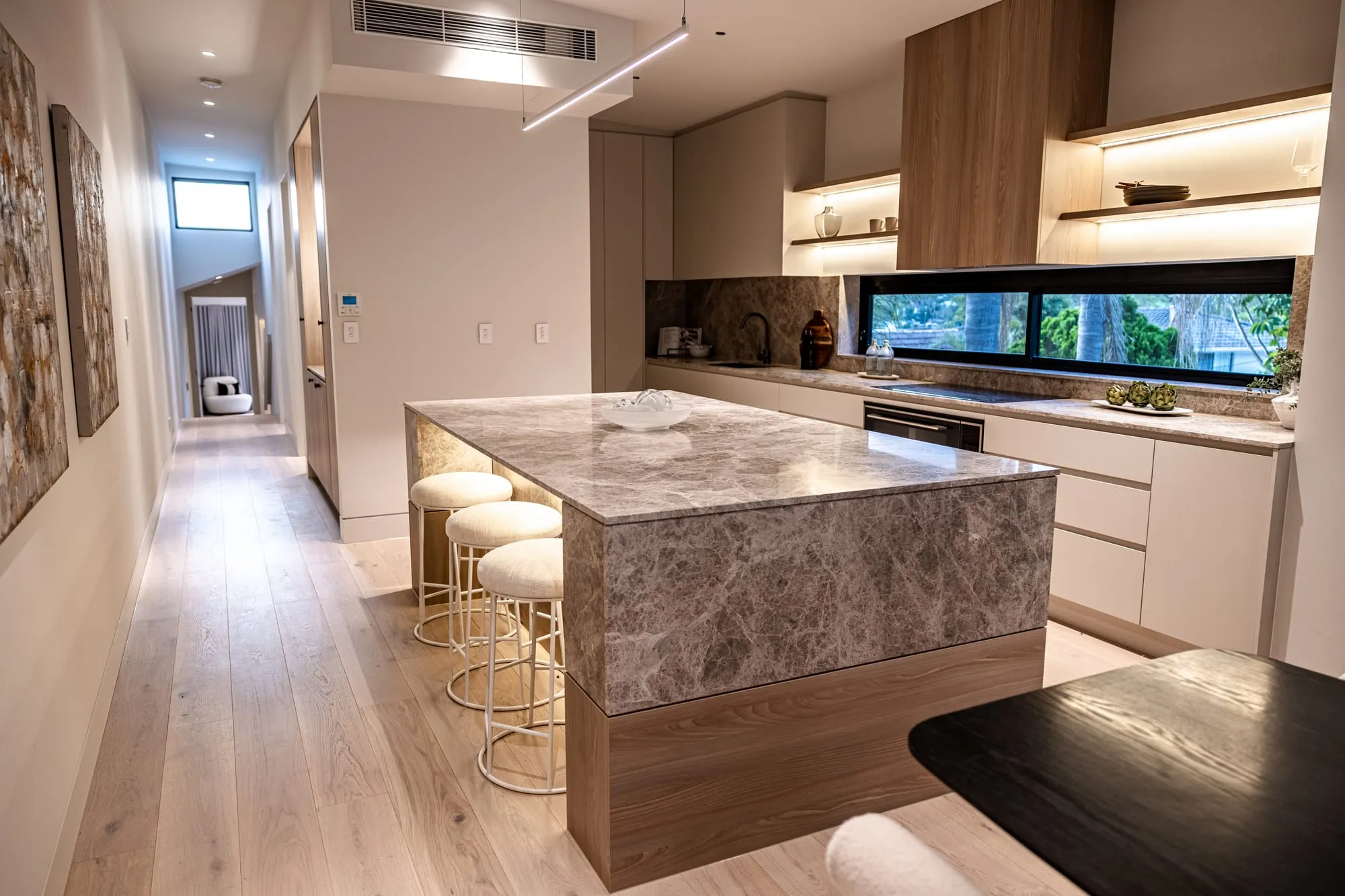 Stone island bench and timber joinery in the kitchen