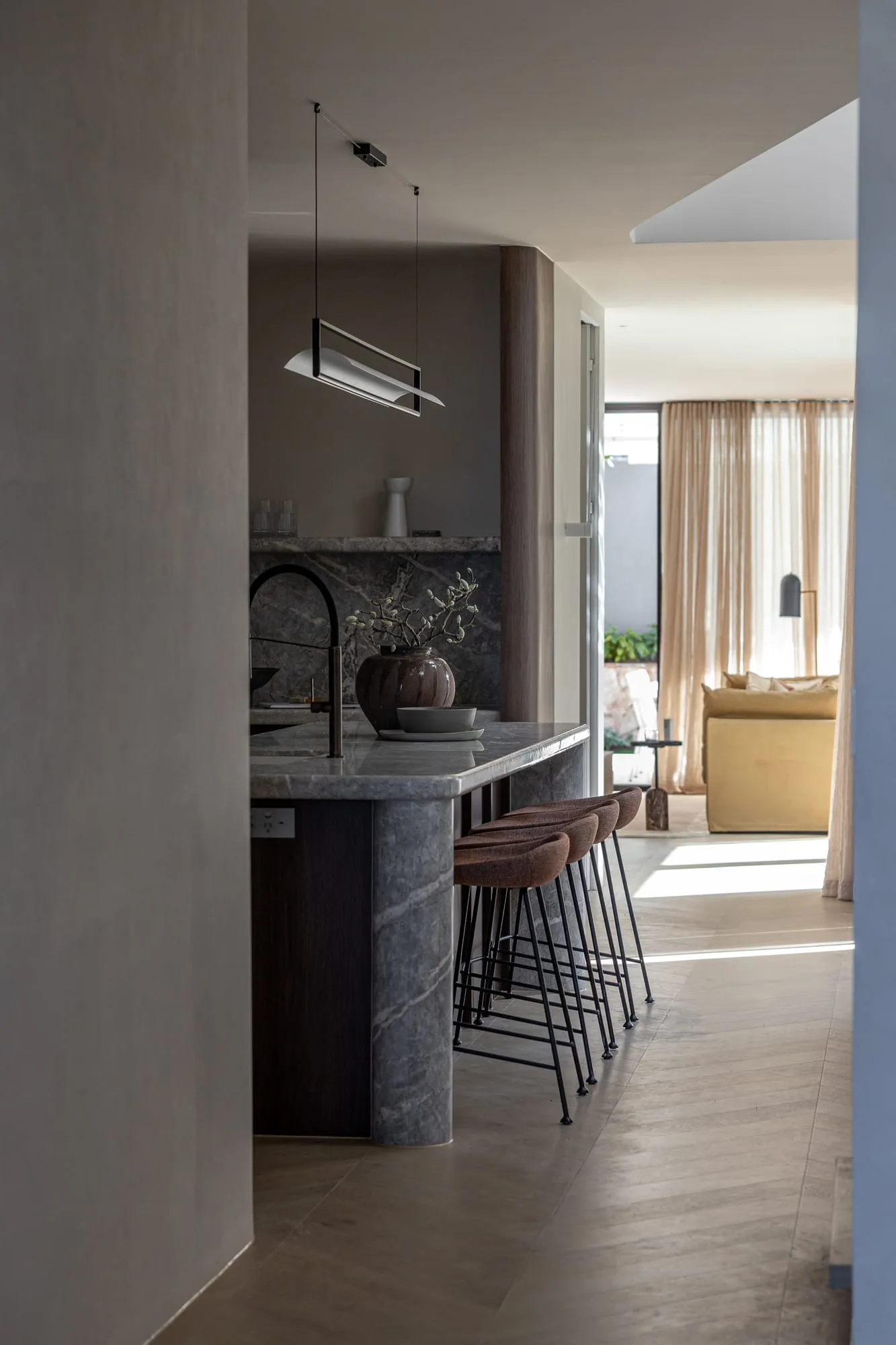 Custom kitchen with natural stone splashback and timber joinery