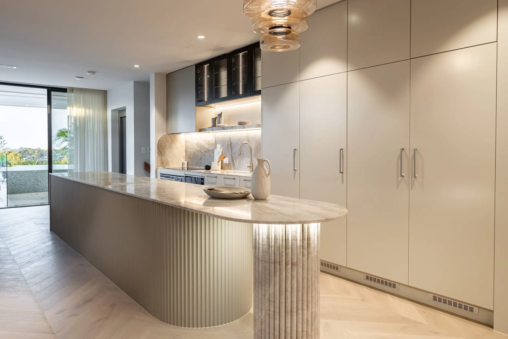 Open-plan kitchen and living with a district outlook