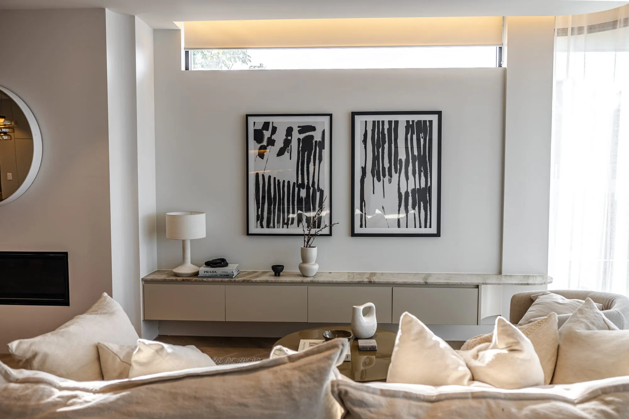Lounge with soft furnishings and framed artwork