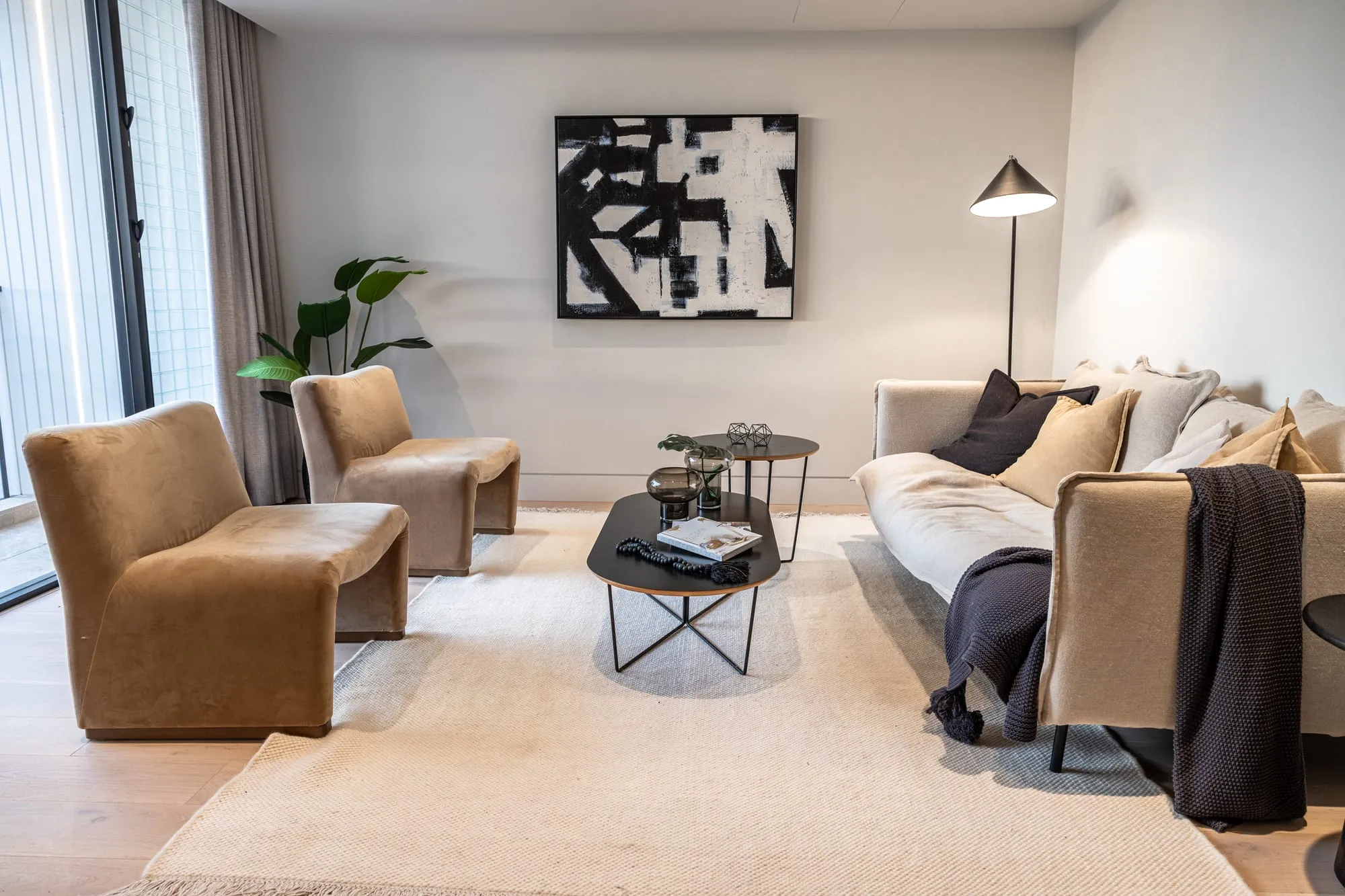 Lounge with feature artwork and a media wall