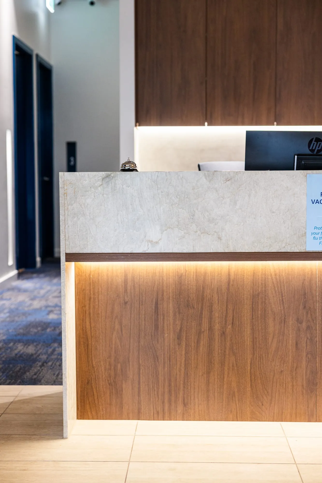 Reception counter with warm under-bench lighting