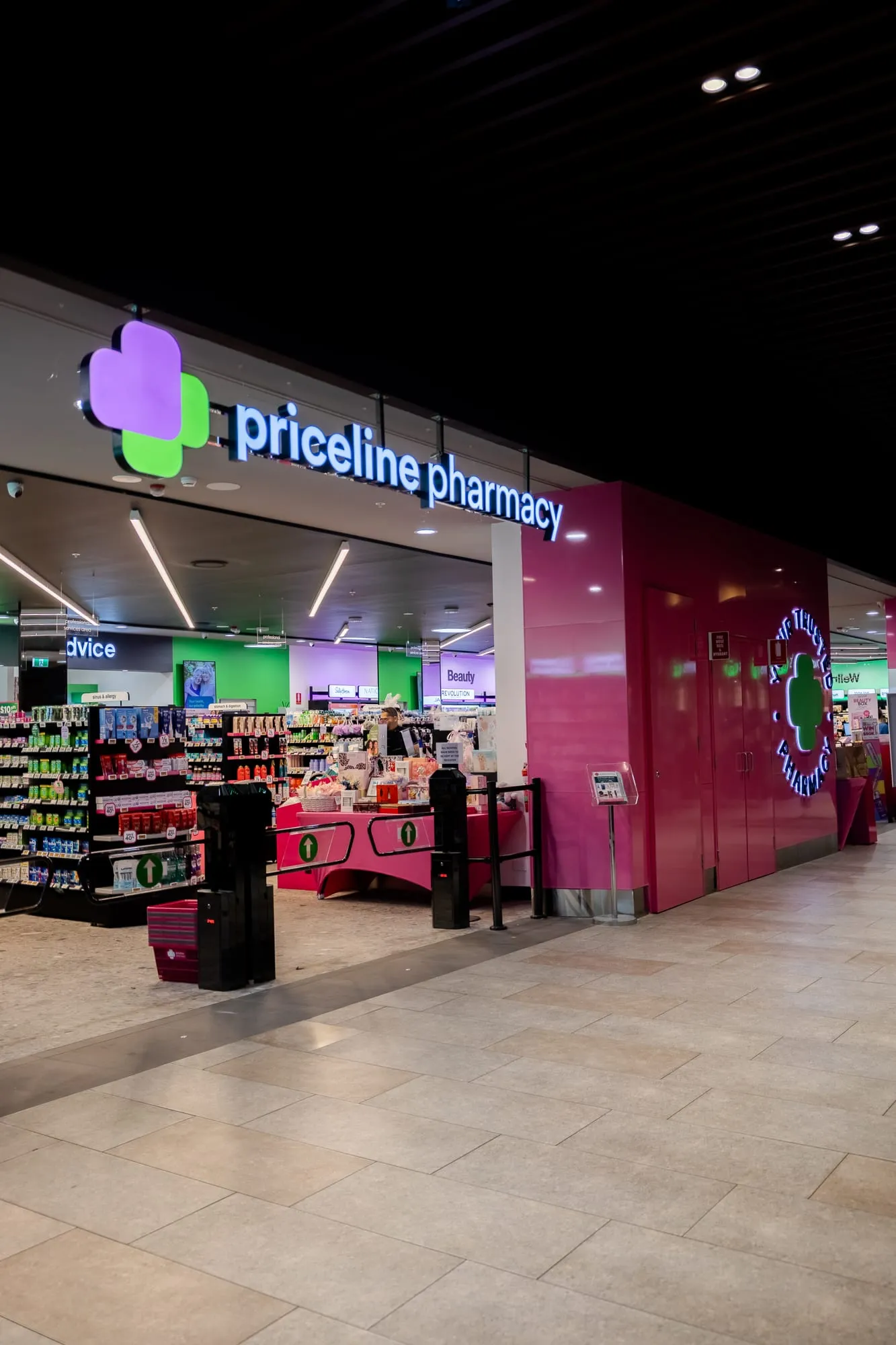 Pharmacy shopfront with feature colour and lighting