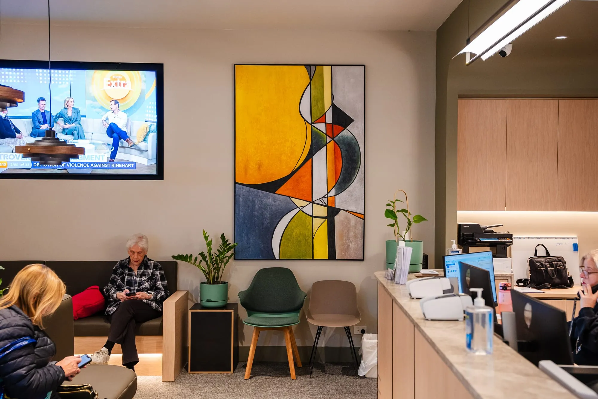 Waiting lounge with feature artwork and joinery