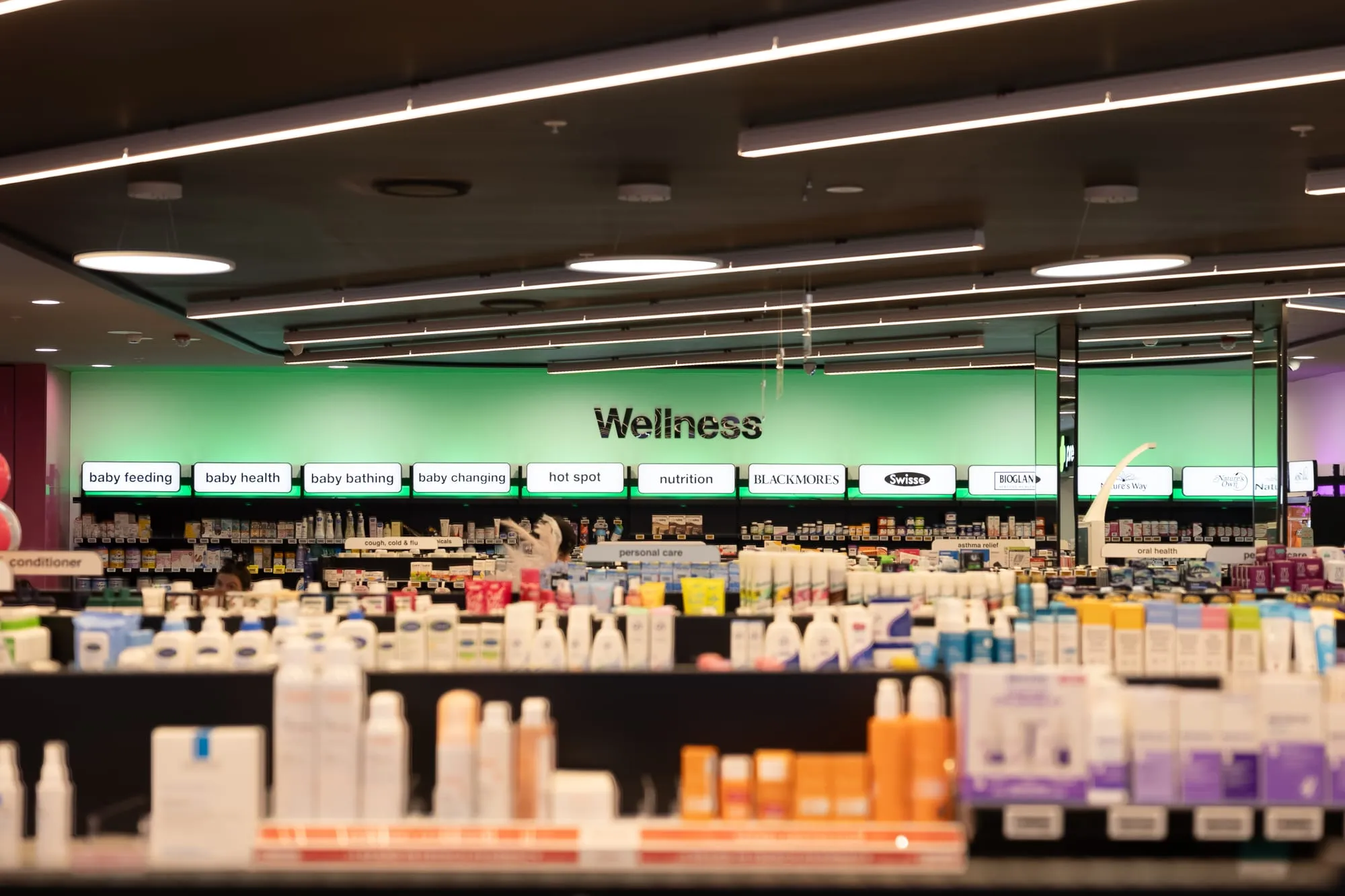 Wellness department with fitted shelving and clear wayfinding